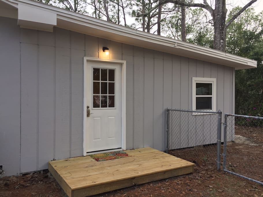 Your home away from home has its own private entrance in the back of the main house. Park in the driveway and walk toward the backyard. The entrance is on the left.