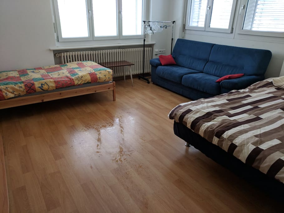 Large bedroom with double bed and a single bed