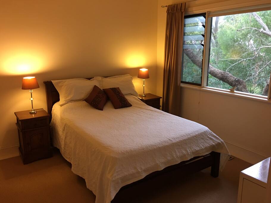 Bedroom with 2 closets, ceiling fan and chest of drawers