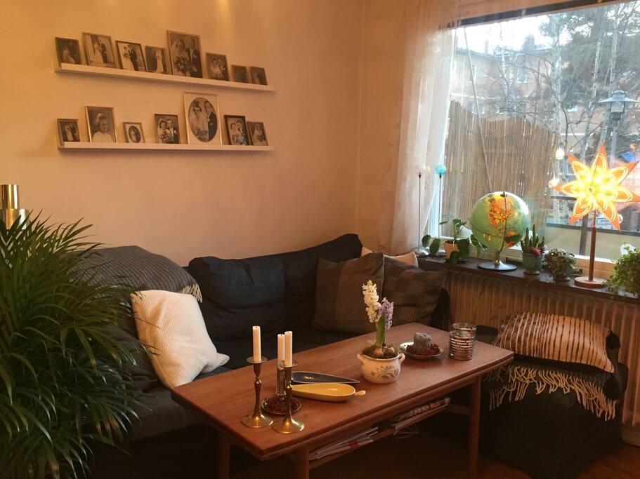 The living room with a comfortable couch, tv and speakers for music - and a great balcony with a quit area outside.