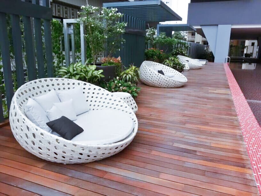 Relaxing place next to swimming pool.