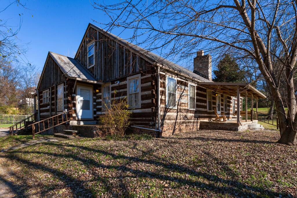 Outside front and side of house, showing 2 kitchen entries and front porch