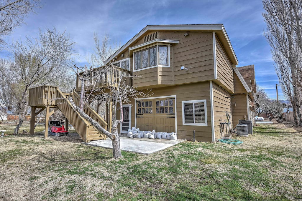 The large home offers a shared backyard with plenty of space to lounge around in the outdoors.