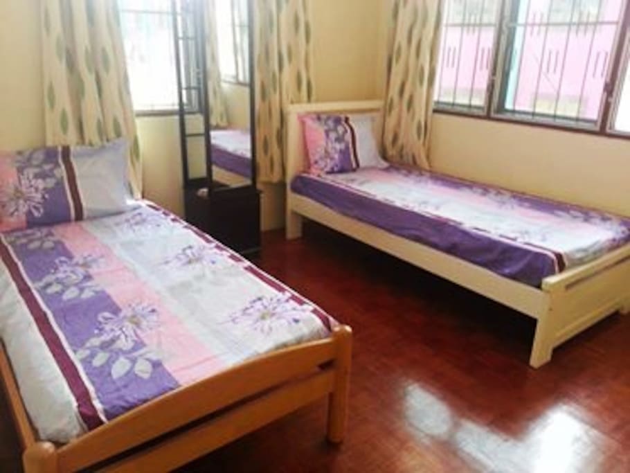 Two Single Bed Room with Air Cond (Will provide additional mattresses is there is more than 2 guests)