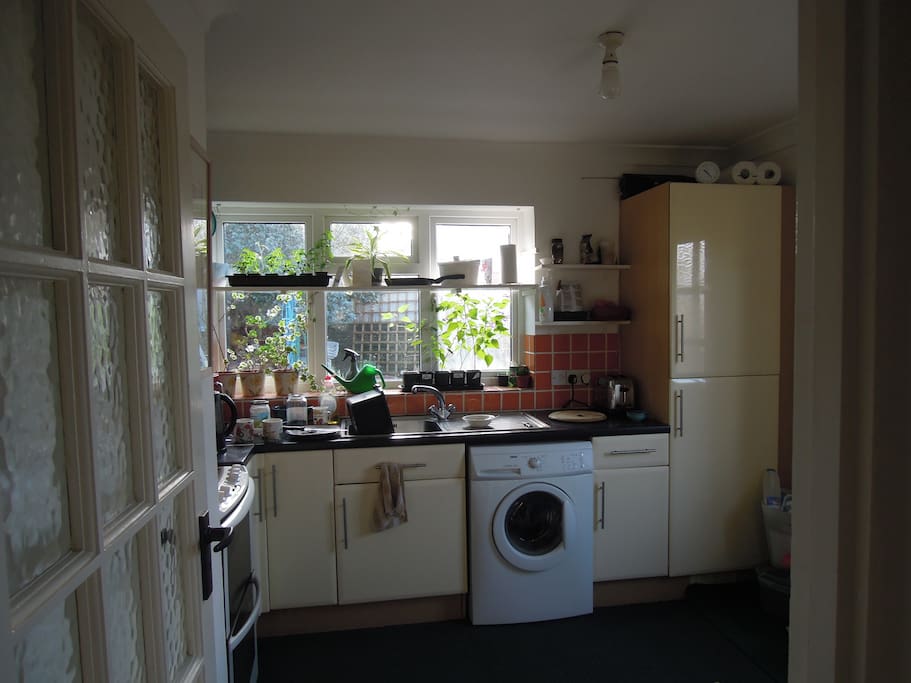 kitchen with dining table washer ect freezer in the garage