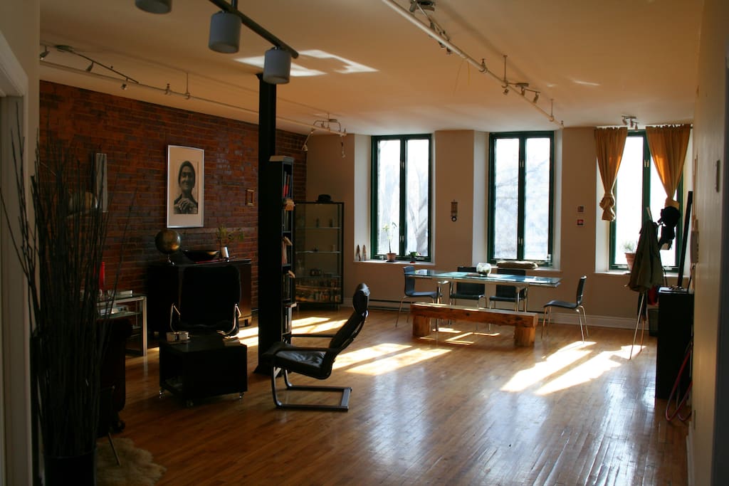 Massive open loft concept with original brick and hardwood floors.