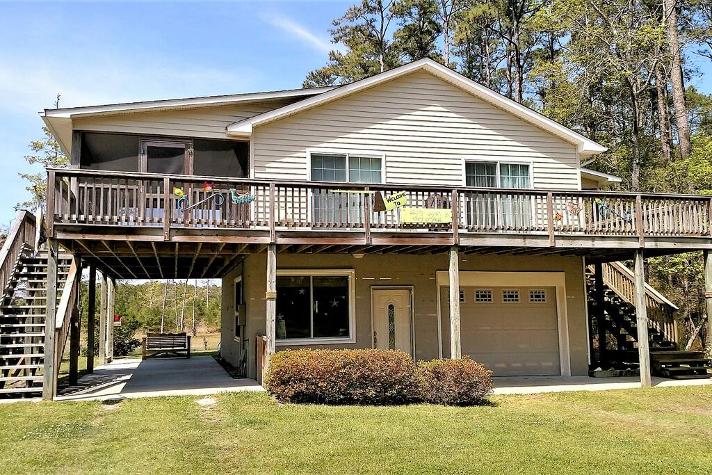 Wrap around deck with the back screened in for your protection from insects and weather. Has ceiling fans and seating.