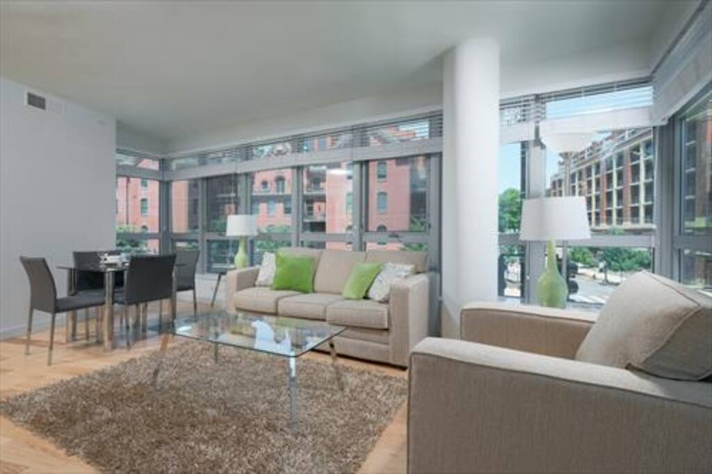 Comfortable living room with pullout sofa bed and club chair