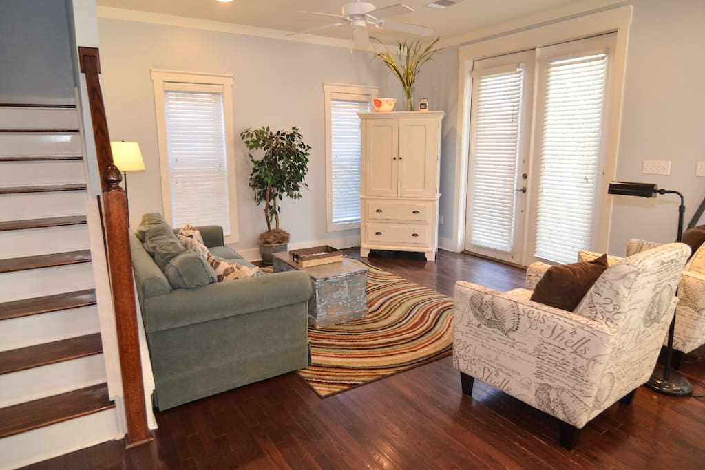 Bright and airy living area affords comfy seating
