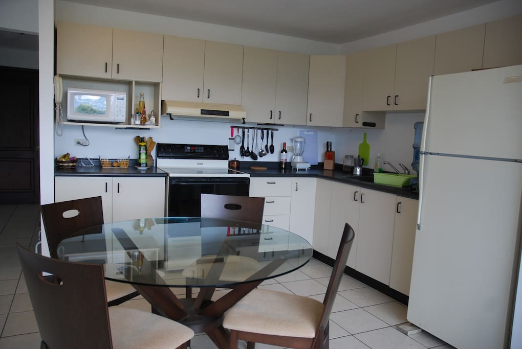 The kitchen is modern and all furnished.
