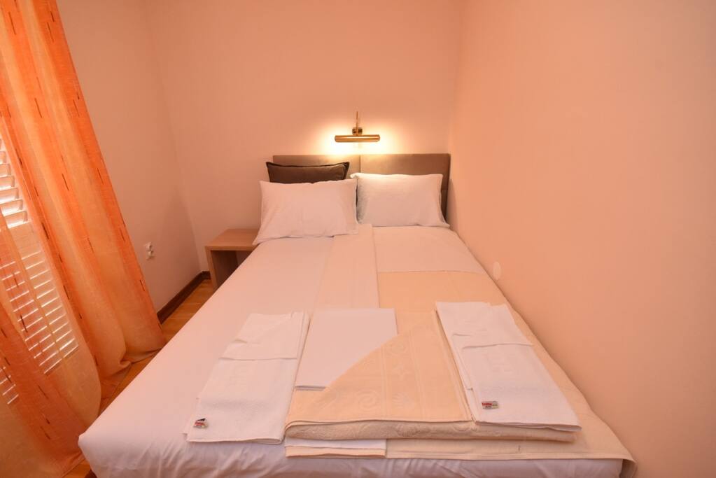 Double bad bedroom with balcony