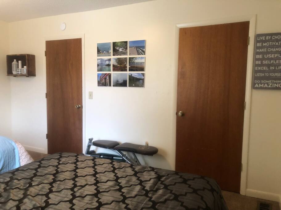 Private bedroom: closet and bedroom doorways pictured; bench and hand weights for light work out (or to hold luggage!)