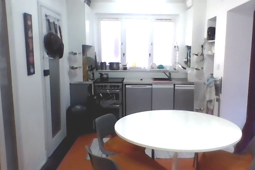 fully equiped kitchen with big selection of pans and utensils