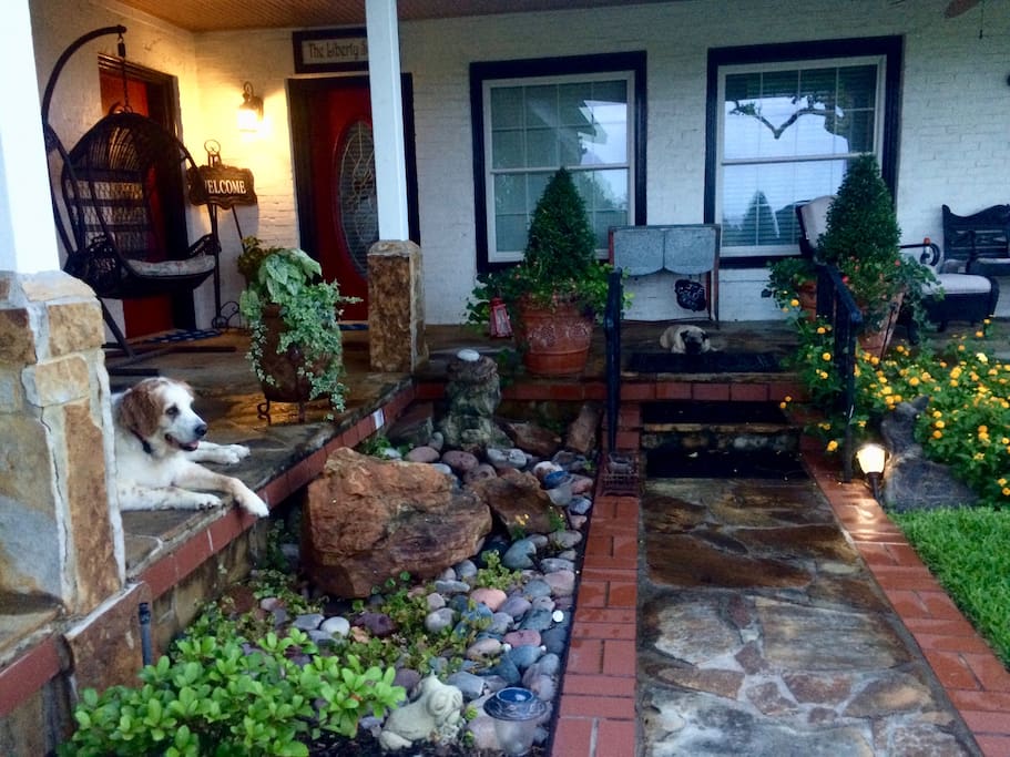 Mr. Pibb (pug) and SandiJo ( Large Mix Breed ) relaxing on the east porch.