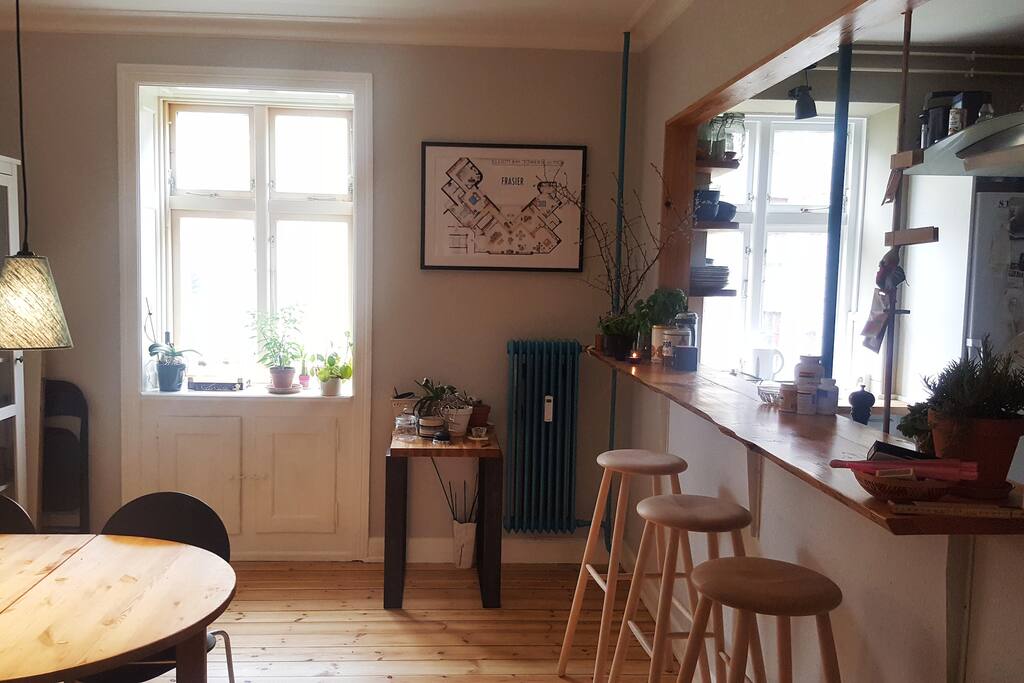 The dining table to the left which can unfold and seat 6-8 people