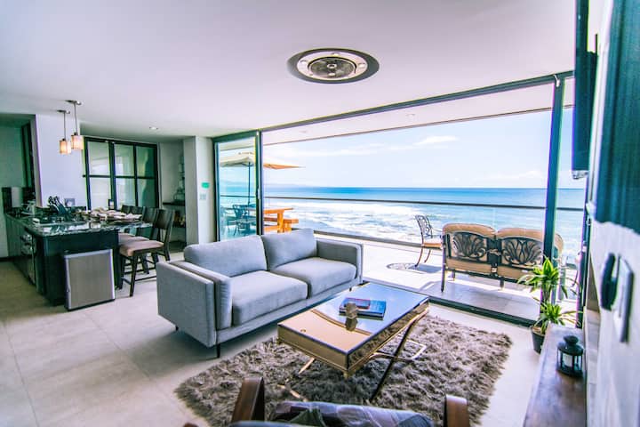 Floor-to-ceiling windows can be opened to allow you to fully enjoy the ocean breeze from the comfort of the living area.