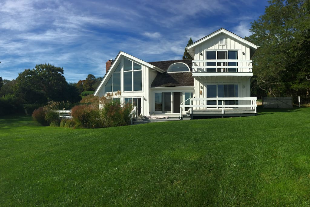 Exterior view of house. Secluded, rolling lawn, with lots of light