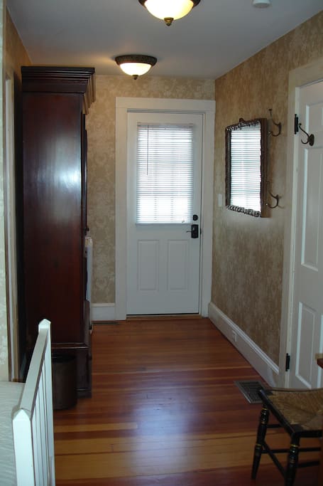 Private entrance opens up to the deck and yard