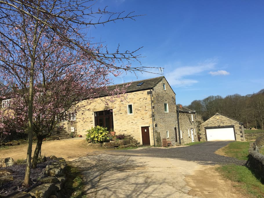 Main Barn and stable block to the right (brown door)
