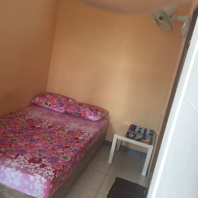 Room with Fan+Window and Bathroom inside.