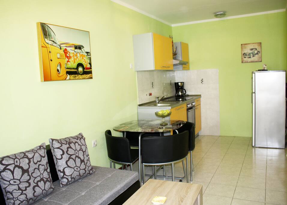 Kitchen and dinning table, fridge, coffee machine