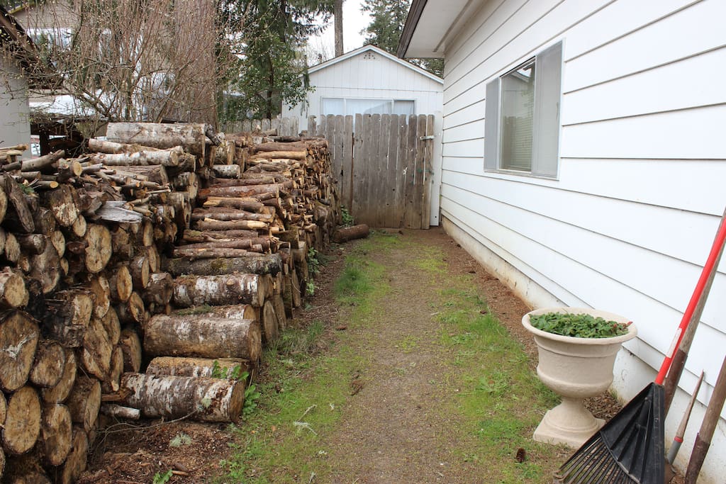 Follow the wood path around the side of the house