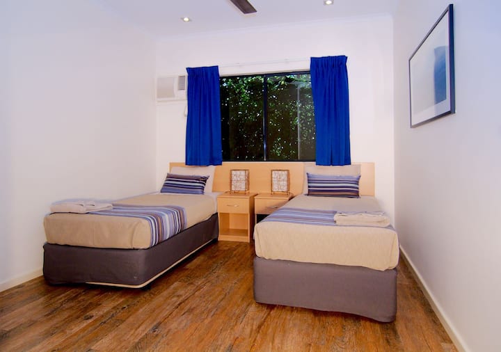 Single beds for kids to sleep in a comfortably air conditioned bedroom