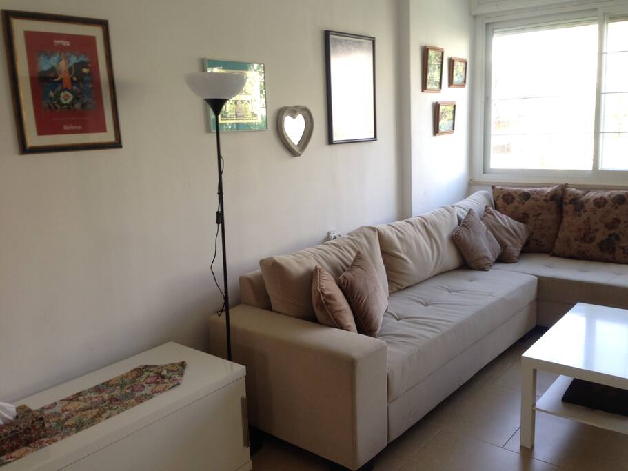 Reading lamp for gentle lighting. Side table is equipt with puzzles & a few magazines.