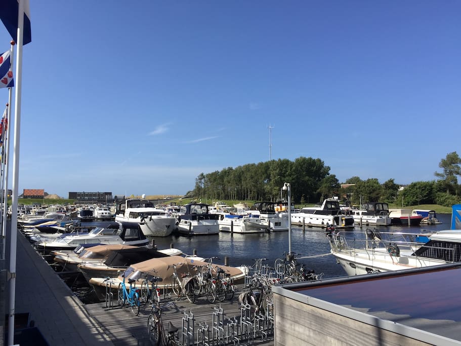 The harbour at 10 steps from hout house. Behind the last building you see, there is the sea.