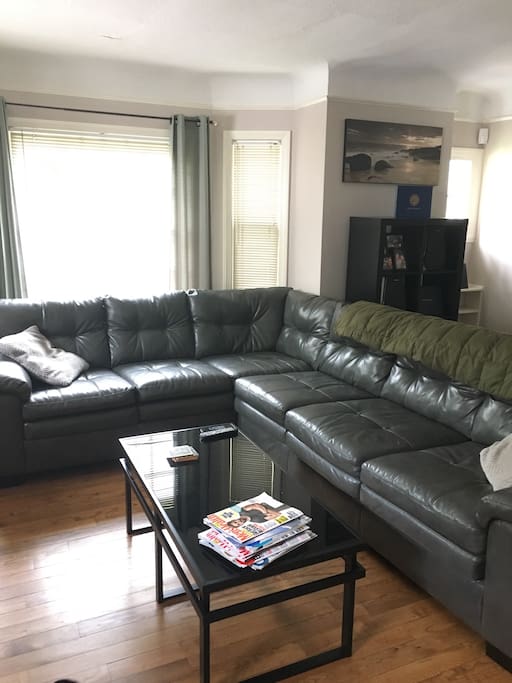 Living room with huge sectional. Easily sleeps 2.