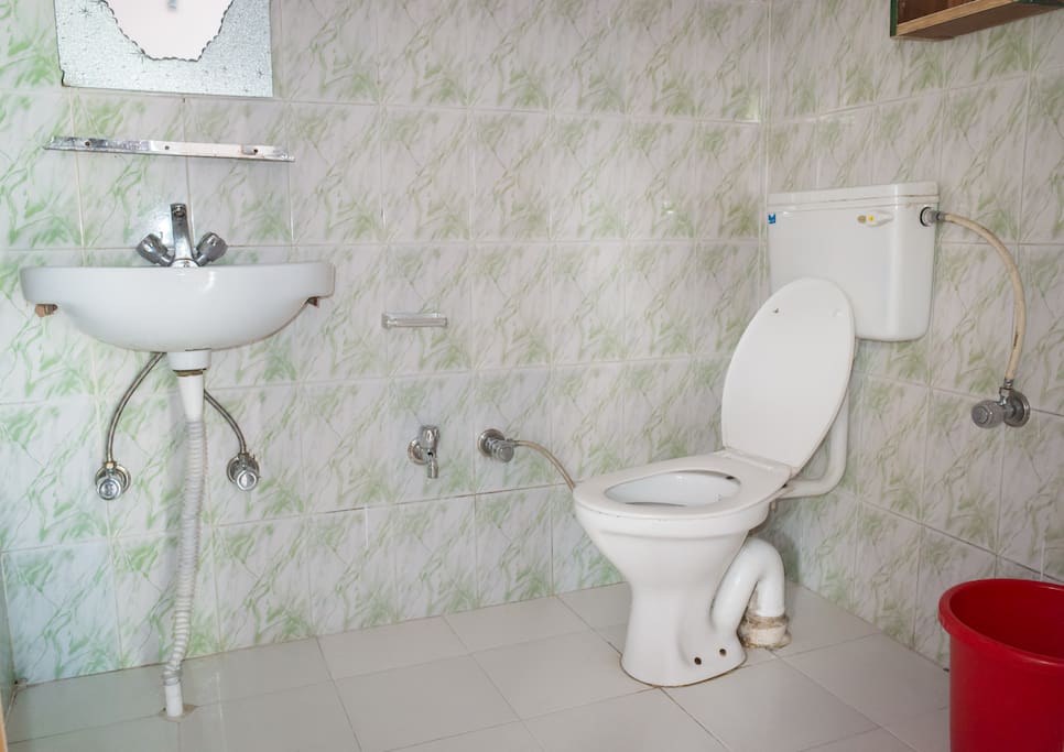 Western style toilet and shower with 24/7 hot water
