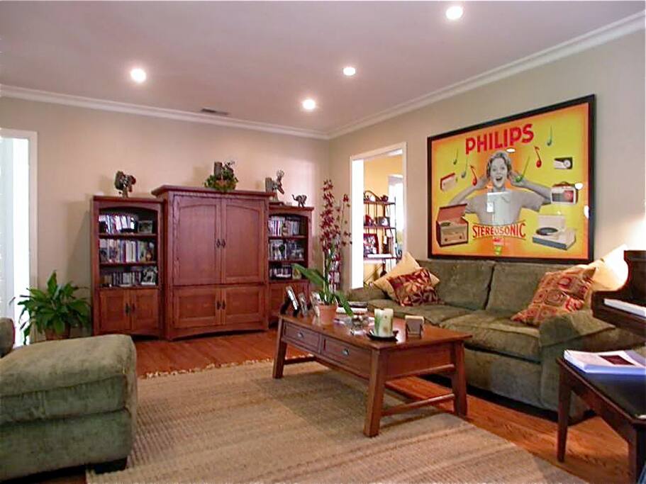 Living room/den features flat screen, cable and Apple TV, stereo, surround sound, and wood-burning fireplace.