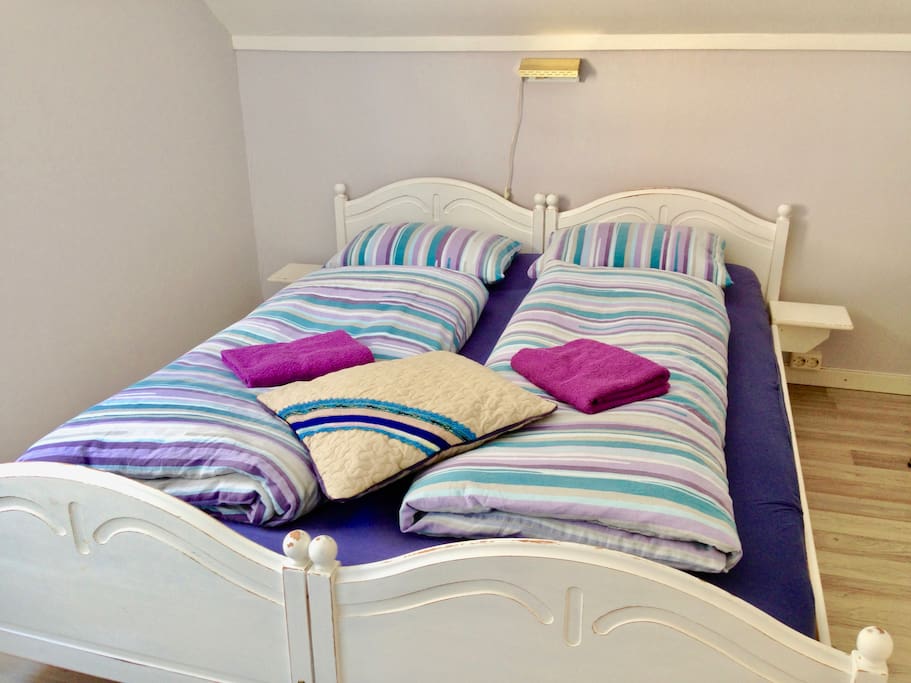 The room "STRAND". Comfy double bed with new mattresses.