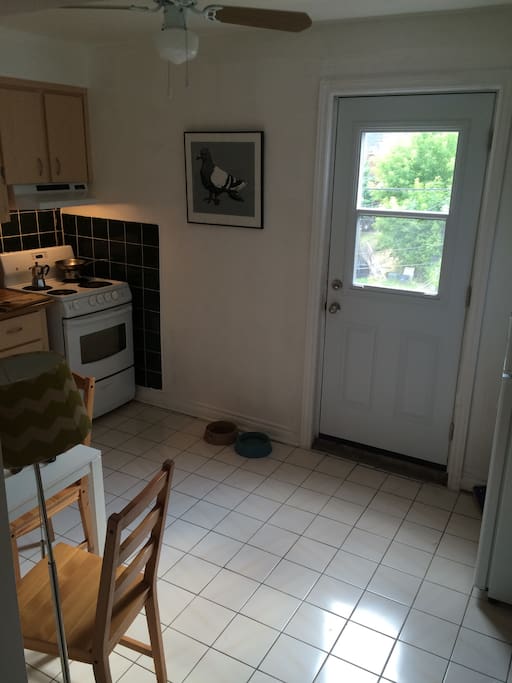 Nice clean kitchen with espresso machine.