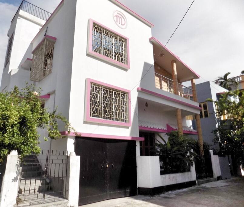 Left Outside view of the house from