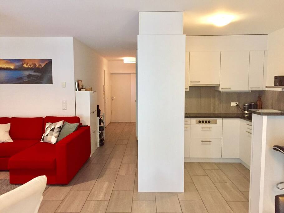 The kitchen leads into living room and enclosed verenda