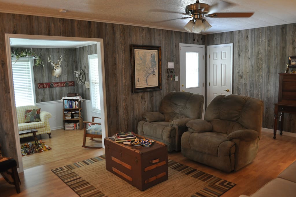 Front entrance to living room with two recliners