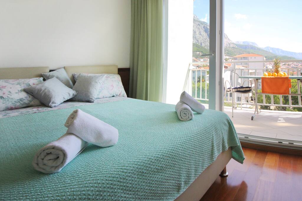 View of the bed and the balcony