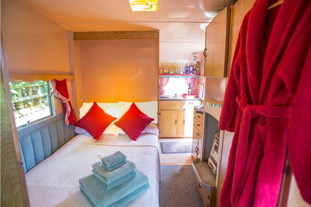 Small double bed that folds away into a cupboard during the day