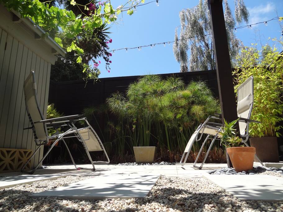 Direct access to outdoor lounge space with water feature.
