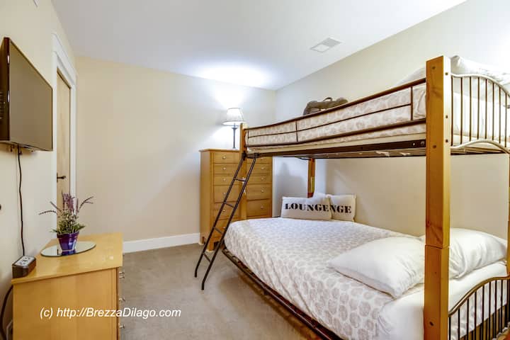 Guest Bedroom with Full Size lower bunk and single upper bunk. Premium Mattress and bedding. Wall Mounted Roku TV includes Netflix, Amazon Prime Videos.
