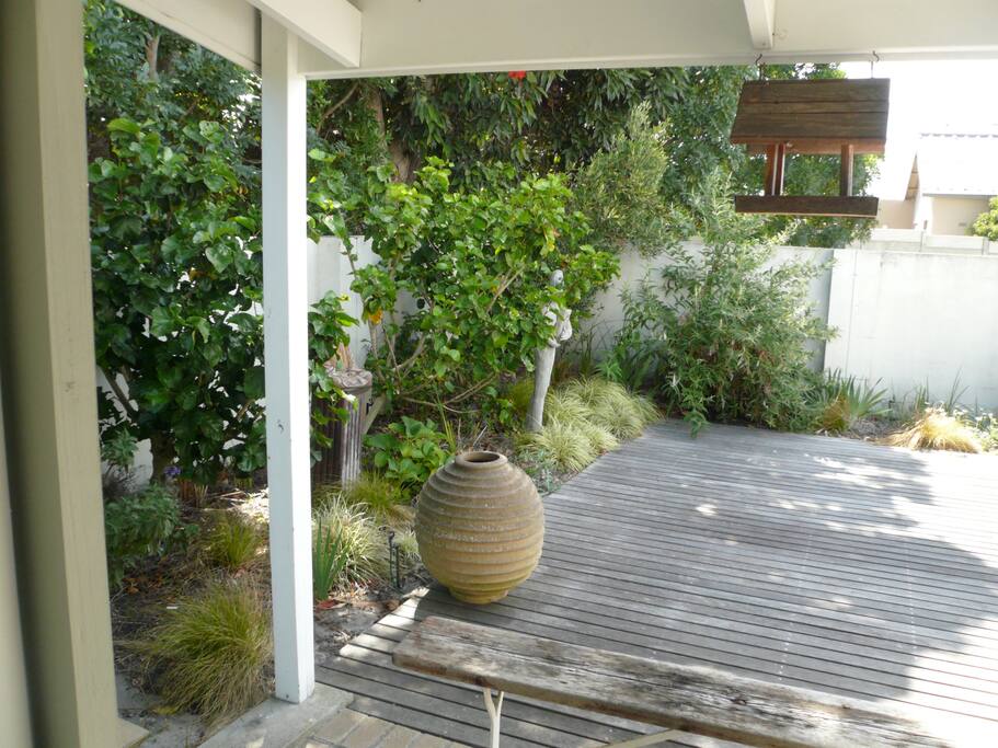Through French windows to deck.