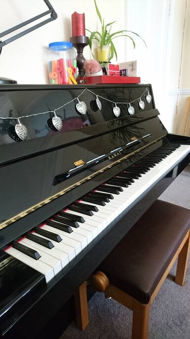 lovely Kawai upright piano, in tune (natch) - feel free to play