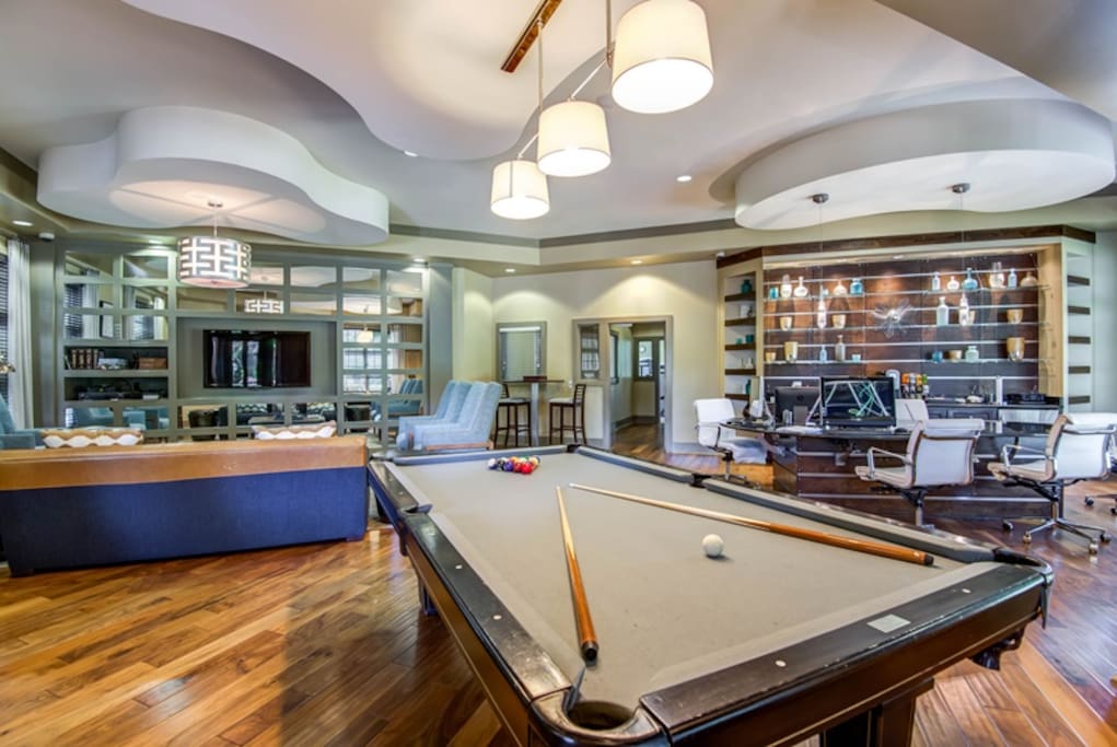 Common room with printer, TV, games, billiards, and coffee