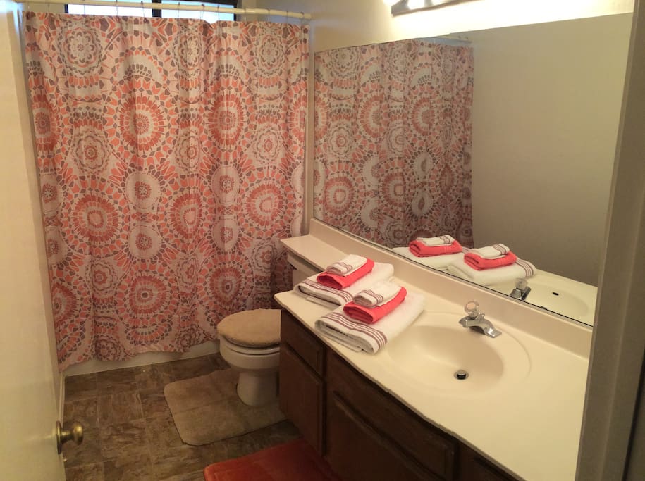 Spotlessly Clean Bathroom With Amenities