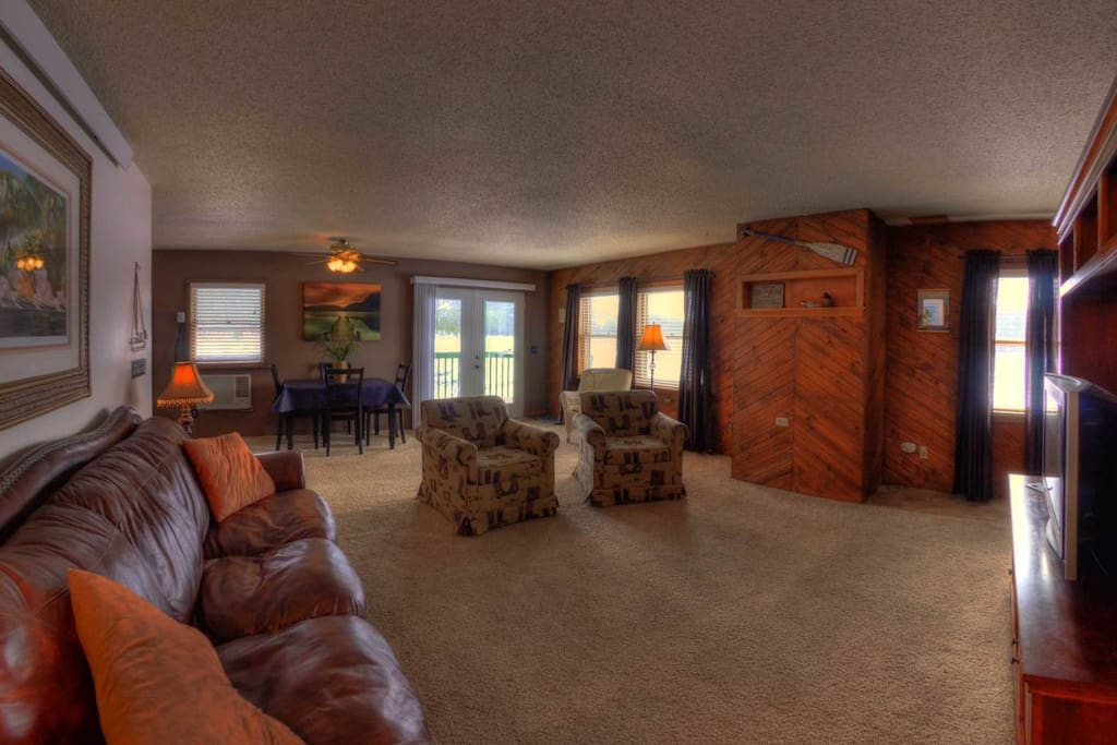 Large living room with satellite TV.