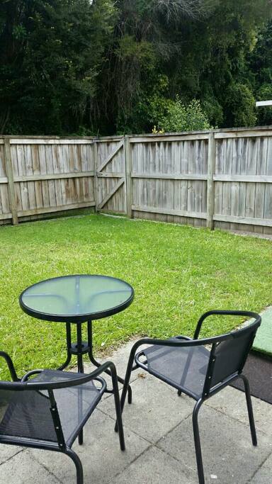 Private courtyard with bush backdrop