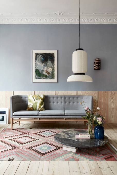Lounge with white stained plywood high-panelling