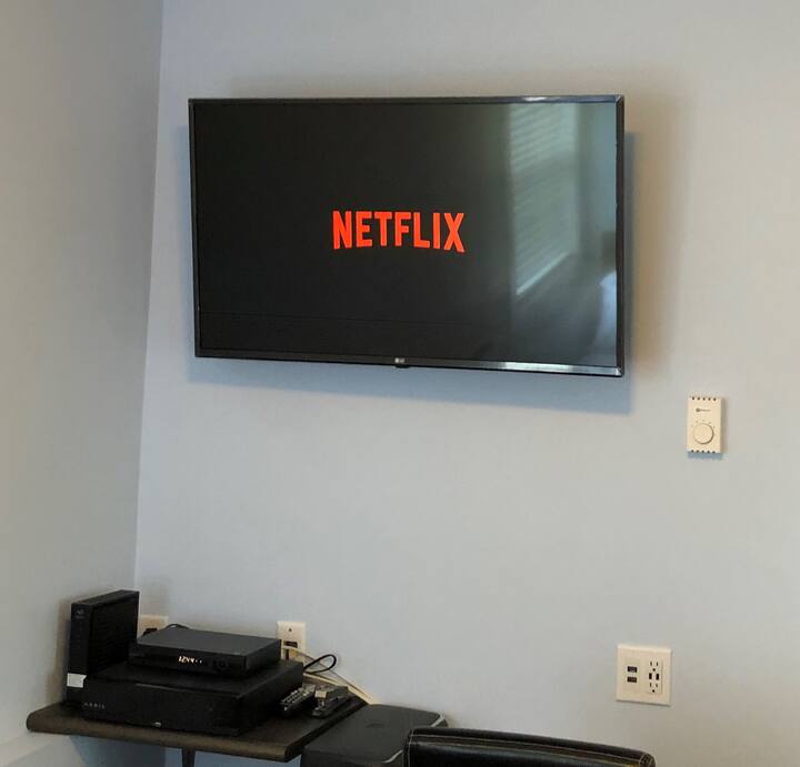 The TV features Netflix and cable