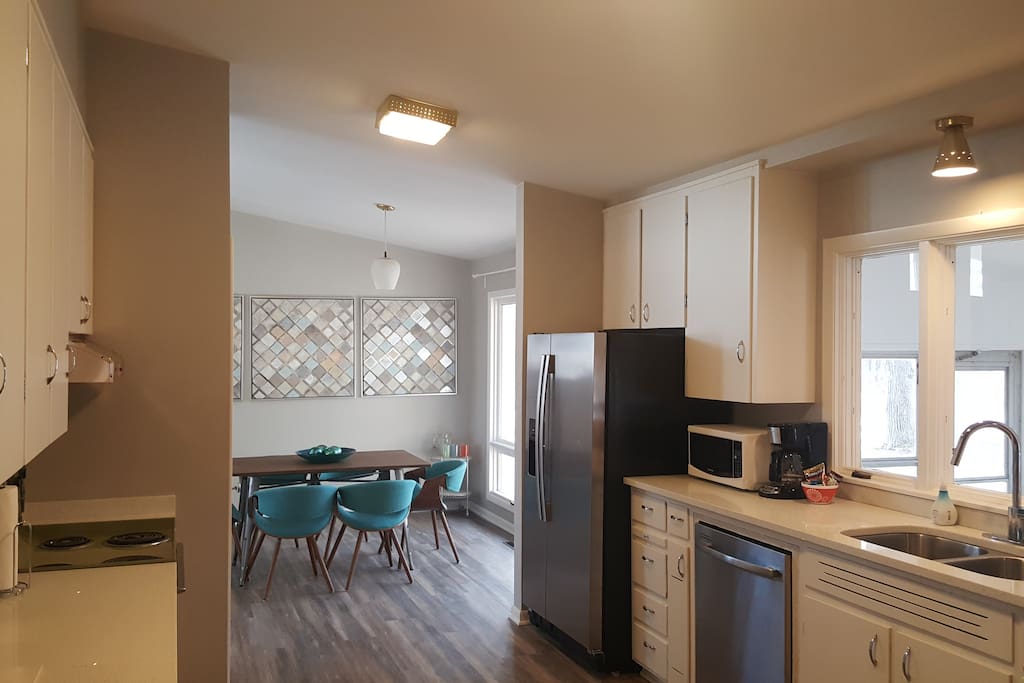 The Kitchen - Retro and modern, open and airy. Includes fridge with filtered water and ice, stove, oven, dishwasher, microwave, toaster, and coffee for your morning wake-me-up. The kitchen is stocked with cooking tools.